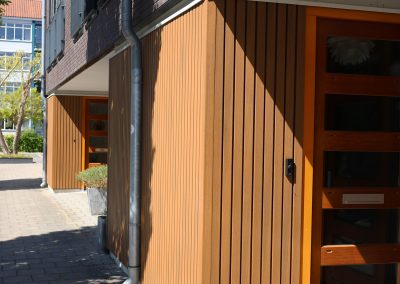 Portiek appartement met gevelbekleding